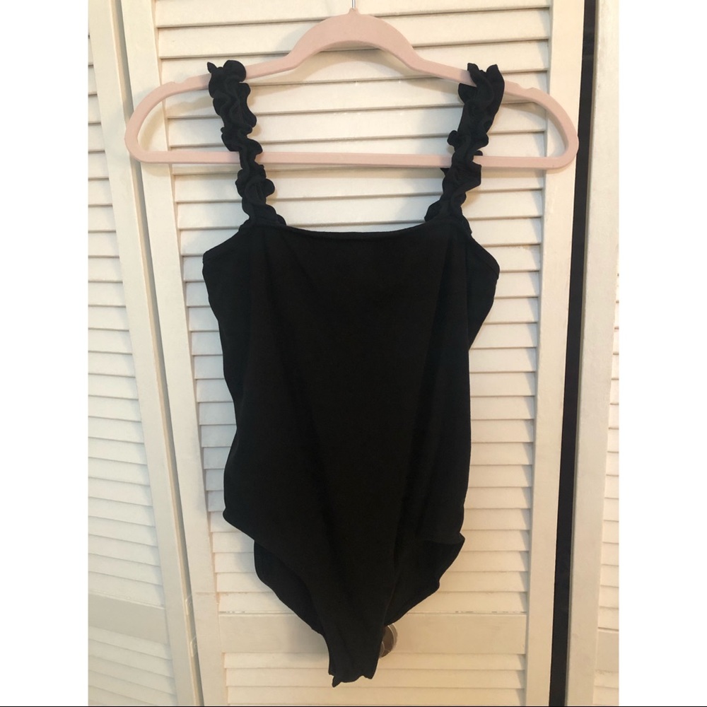 Black body suit with ruffle sleeve